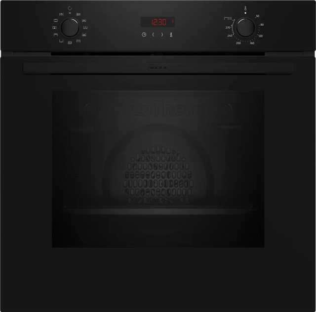 Black oven with digital display and control knobs on a black background