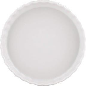 A white ceramic pie or tart dish with a scalloped rim, shown from a top-down view on a white background.