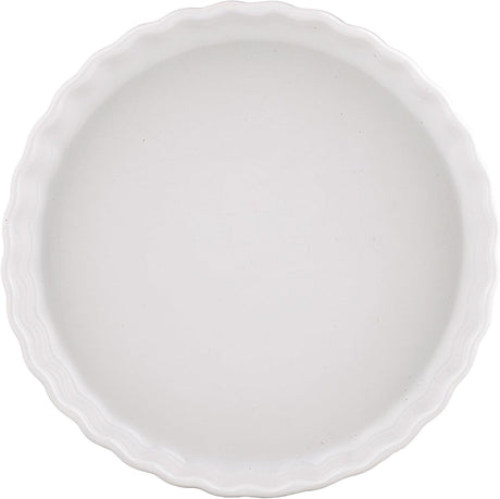 A white ceramic pie or tart dish with a scalloped rim, shown from a top-down view on a white background.